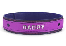 Double strap collar 1.5" wide. Lavender leather* top, black leather bottom, purple lambskin inner lining, lettering in center. *Material is discontinued.