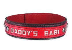 Double strap collar 1.5" wide. Red lambskin outer layer top, black lambskin outer layer bottom, red lambskin inner lining, lettering in center, black stone gems.
