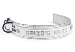 Double strap collar 1.5" wide. White leather top, white metallic bottom, white metallic lambskin inner lining, lettering in center, turquoise gems (discontinued), reinforced black d ring by buckle.