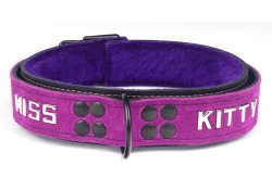 Heavy duty collar 1.25" wide. Violet suede outer layer top, black leather bottom, purple fur inner lining, reinforced black d ring, lettering.