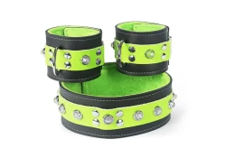 Double strap collar and cuffs, 2" wide. Lime green leather top, black leather bottom, lime green fur inner lining, crystal dome gems, d ring in center on cuffs, no attachment on collar
