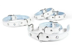 Collar, wrist and ankle cuffs, all 0.75 wide. White leather, baby blue fur inner lining, silver d ring in center, opal mini gems (have to be applied through the fur).