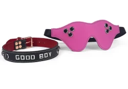 Collar: 1" wide, black leather, crimson lambskin inner lining, lettering in center, black stone gems. Blindfold is made with pink leather and has onyx gems,