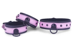 Double strap collar and cuffs 1.25" wide, 3/4 top style. Rose leather top, black leather bottom, large black d ring with clamp, black dots