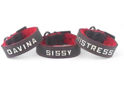 3 individual cuffs, all 1" wide. Black leather, red fur inner lining, lettering in center*, black d ring by buckle