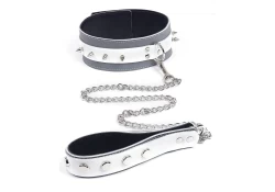 2" wide collar and 1.25" wide leash. White leather top, grey leather bottom, black suede inner lining, silver d ring and spike son the collar, raised dots on the leash