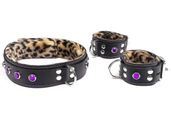 Double strap collar and cuffs 1.5" wide. Black leather top and bottom, baby leopard fur inner lining, d ring and amethyst gems.