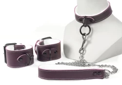 Single strap collar and leash (1" wide), and wrist cuffs (2" wide). Chocolate raspberry leather, white fur inner lining, black d ring on cuffs, and black loop & dee on the collar.