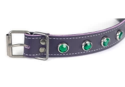 close up of a nickel-free buckle and emerald gems.