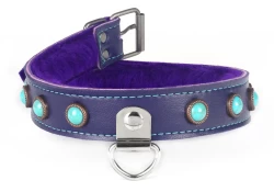 collar width: 1". Purple lambskin outer layer, purple fur inner lining, large d ring with clamp in center, turquoise gems (discontinued), nickel-free buckle.