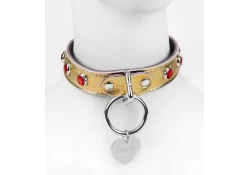 Single strap collar 1" wide. Gold metallic leather, silver loop & dee (with large silver heart custom tag attached), ruby gems