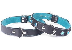 Two single strap collars 1" wide. Black leather, teal suede inner lining, d ring in center, aquamarine gems on the right collar.