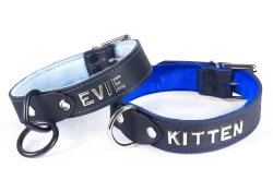 Two single strap collars 1" wide. Left: black leather, baby blue fur inner lining, black loop & dee, lettering. Right: black leather, royal blue fur inner lining, silver d ring, lettering.