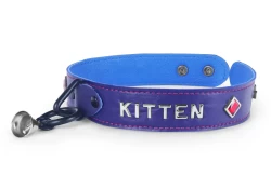 Single strap collar 1.25" wide. Purple lambskin outer layer, carolina blue leather inner lining, lettering, ruby pyramid diamonds, black loop & dee (with small bell attached), nickel-free snaps.