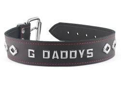 1.25" wide single strap collar. Black leather, black leather inner lining, lettering in center, hollow diamonds on the side.