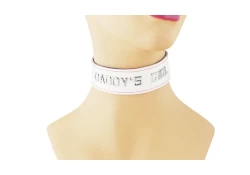 1.25" wide single strap collar. White leather, black lambskin inner lining, lettering.