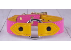 1" wide O-ring collar with wings. Pink leather, gold lambskin inner lining, silver o-ring, brass locking buckle, brass d ring by buckle.