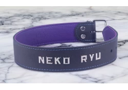 Single strap collar 1.5" wide. Black leather, royal purple leather inner lining, lettering (positioned by the buckle holes by special request).