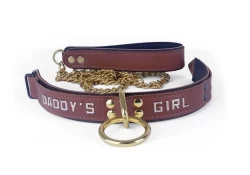 1.25" wide collar and leash. Milk chocolate leather top, dark chocolate leather bottom, black lambskin inner lining, brass loop & dee, lettering.