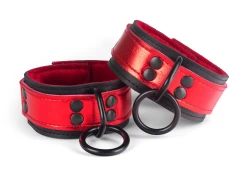 Double strap cuffs, 1.5" wide. Metallic leather top strap, black leather bottom strap, red fur inner lining, black loop & dee attachment