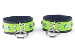 Double strap cuffs, 1.5" wide. Lime green leather top, black leather bottom, black lambskin inner lining, silver loop & dee, aquamarine gems