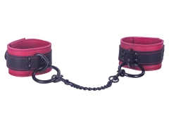 Double strap cuffs, 1.75" wide. Black leather top, red leather bottom, red lambskin inner lining, black loop & dee attachments with black chain link connected.