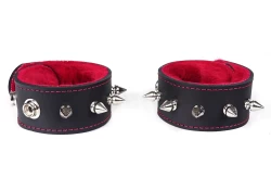 Single strap cuffs, 1.25" wide. Black leather, red fur inner lining, spikes. Snaps for closure (on the back).