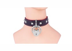 Single strap collar, 1" wide. Black leather with pyramids, loop & dee attachment in center (with lock attached).