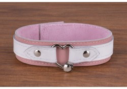1.5" wide collar with wings. White leather top, white leather wings, pastel leather bottom, baby pink cuddle fleece inner lining, silver heart-shaped ring (with medium jingle bell attached)